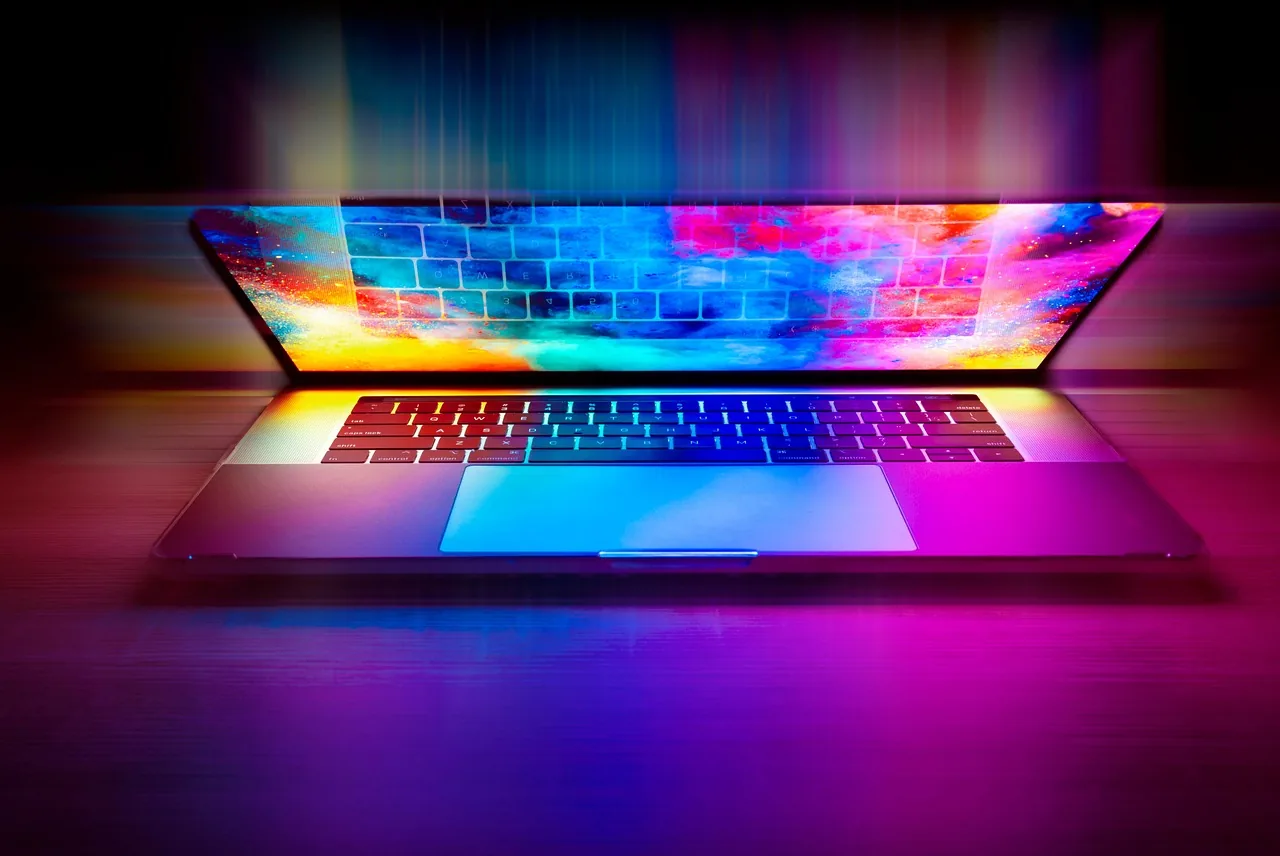 Therapist writing their first blog article on a laptop