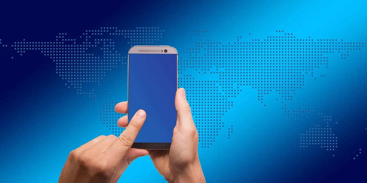 Finger on a smartphone showing a world map, local search