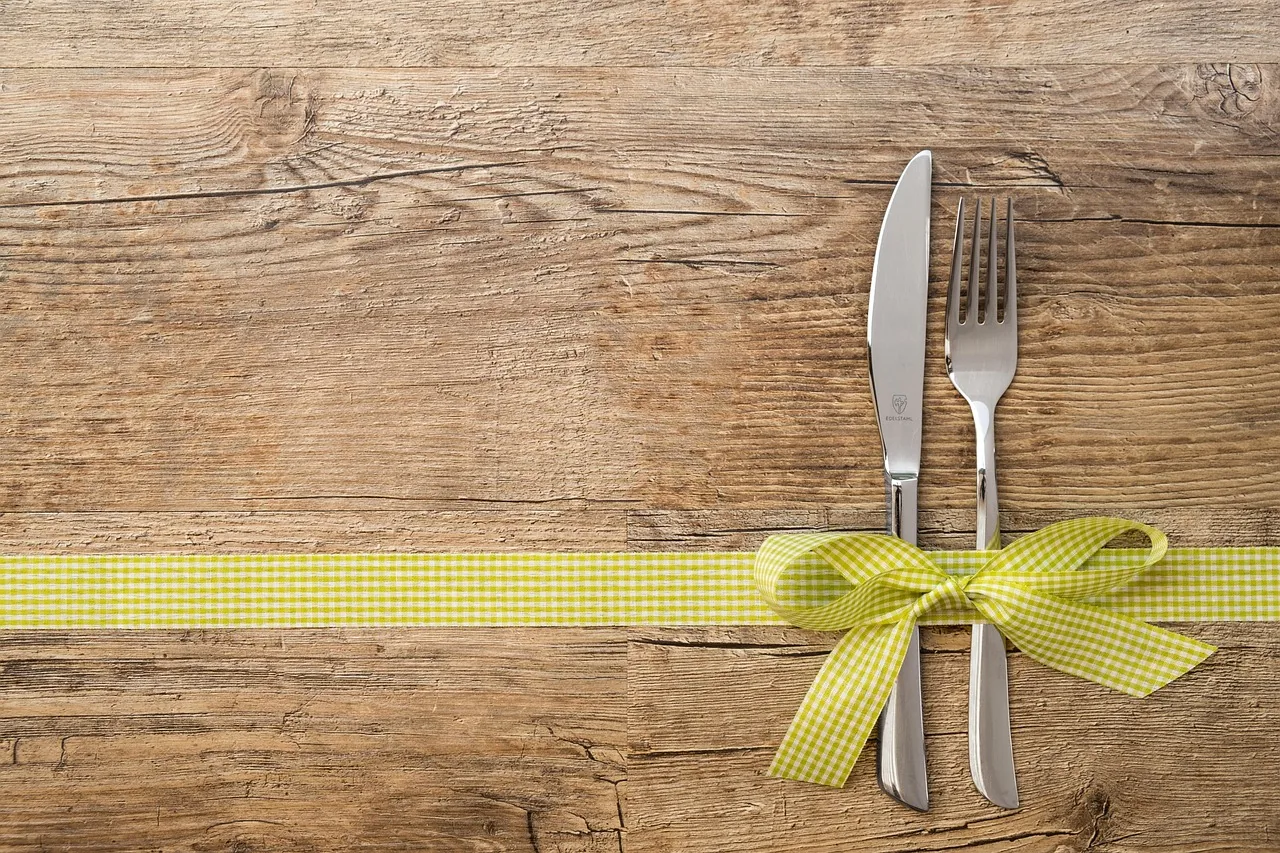 Gift voucher ready to give, next to its ribbon