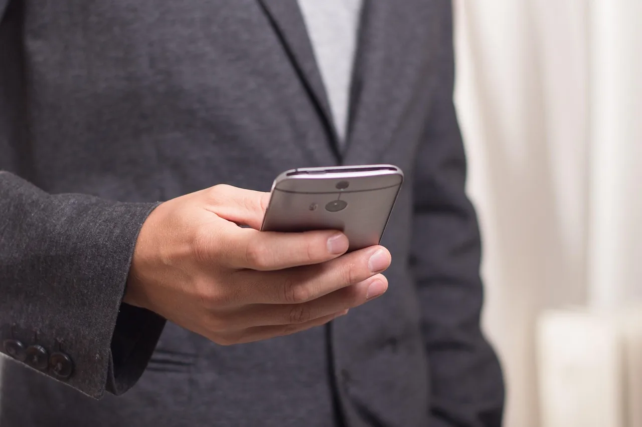 Person holding a mobile phone