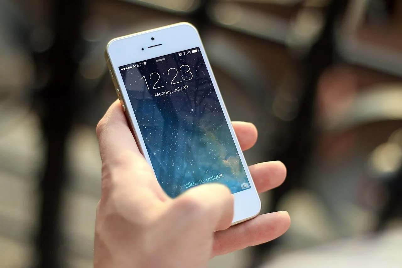 Person sending a message on a smartphone